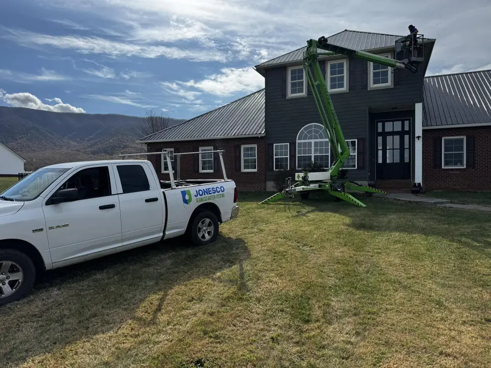 JonesCo truck and boom lift at a two-story home in the East Tennessee mountains