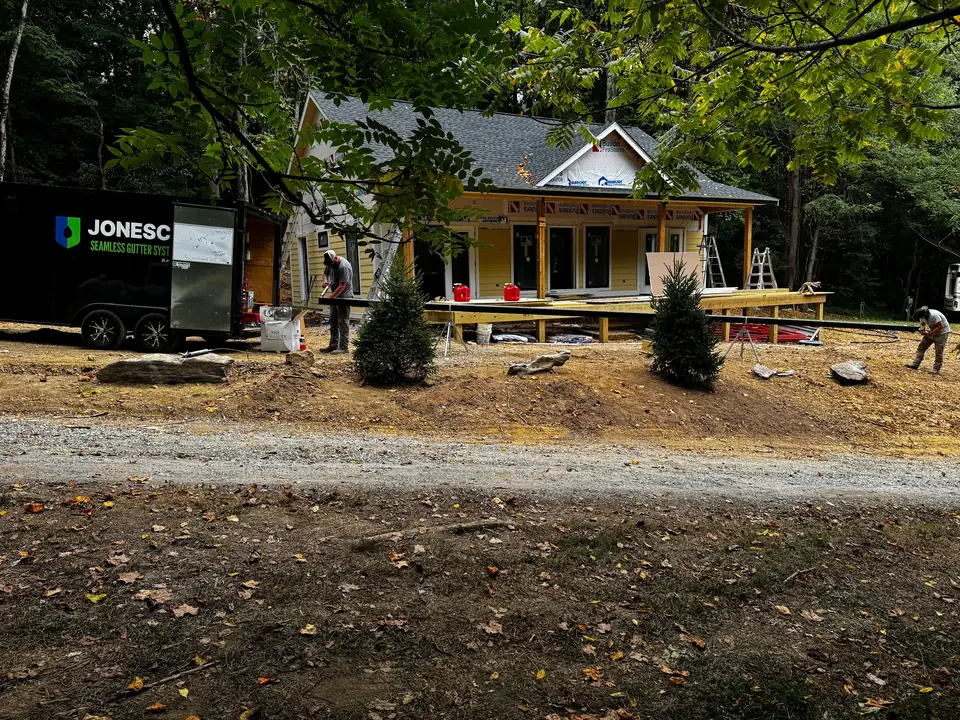 JonesCo crew installing gutters on a new-construction home
