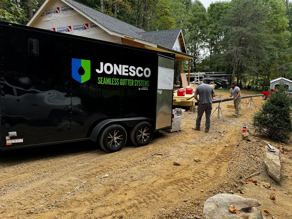 JonesCo seamless gutter trailer and crew on a job site